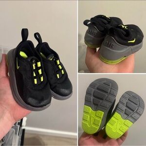 Black and Green Nike tennis shoes